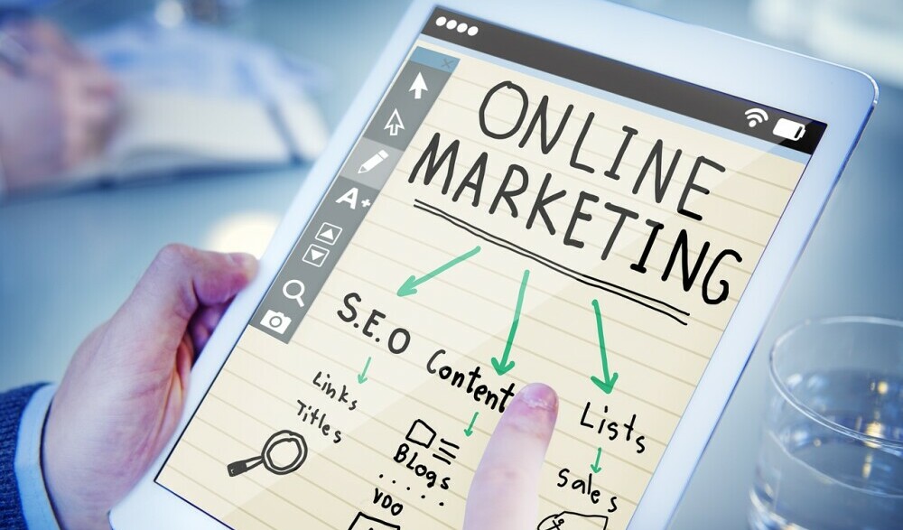Online Marketing - How To Learn Affiliate Marketing For Beginners A Person Holding an I-pad Researching Learning Affiliate Marketing For Beginners