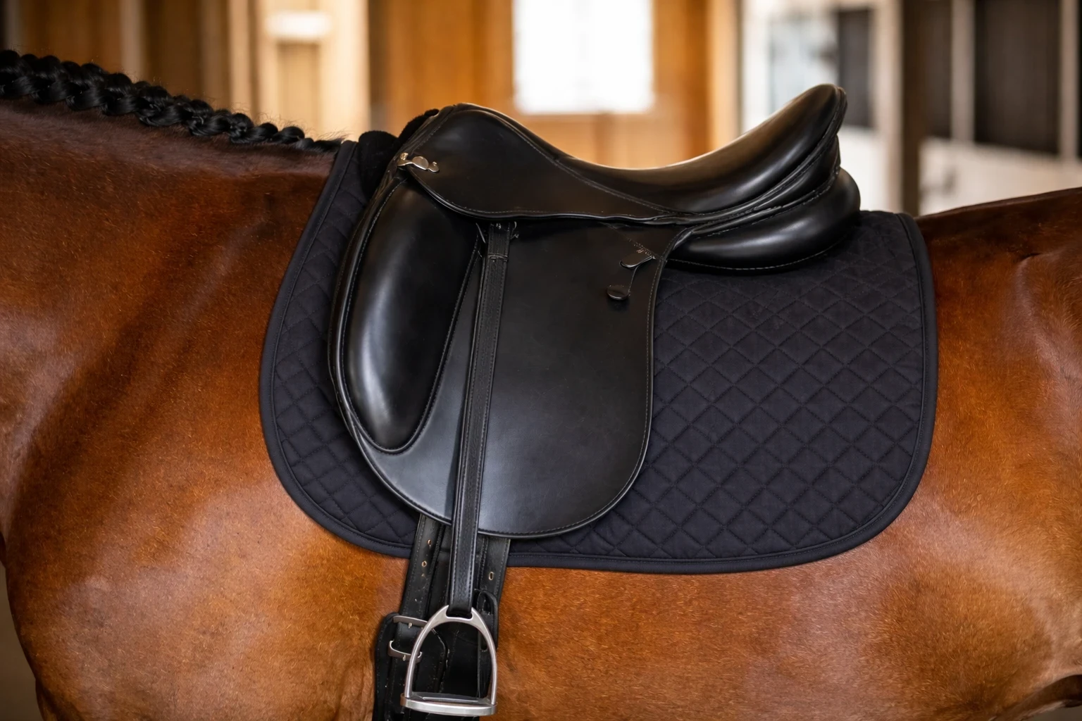 dressage saddle side view showing panels seat and gullet channel
