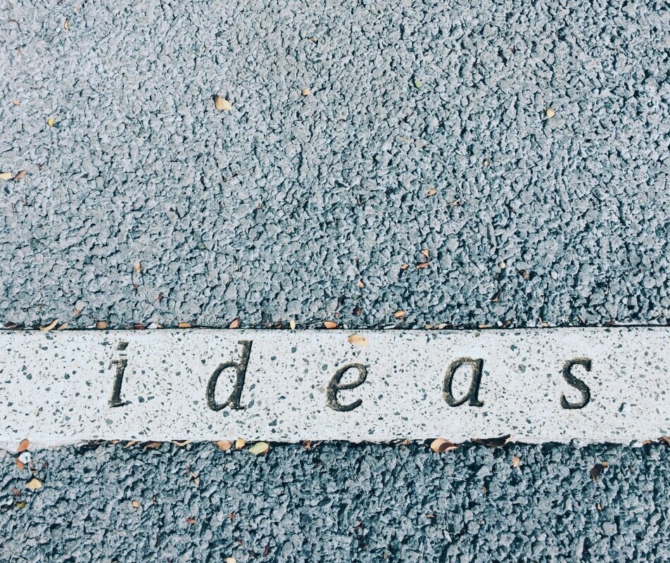 The word ideas in engraved in concrete