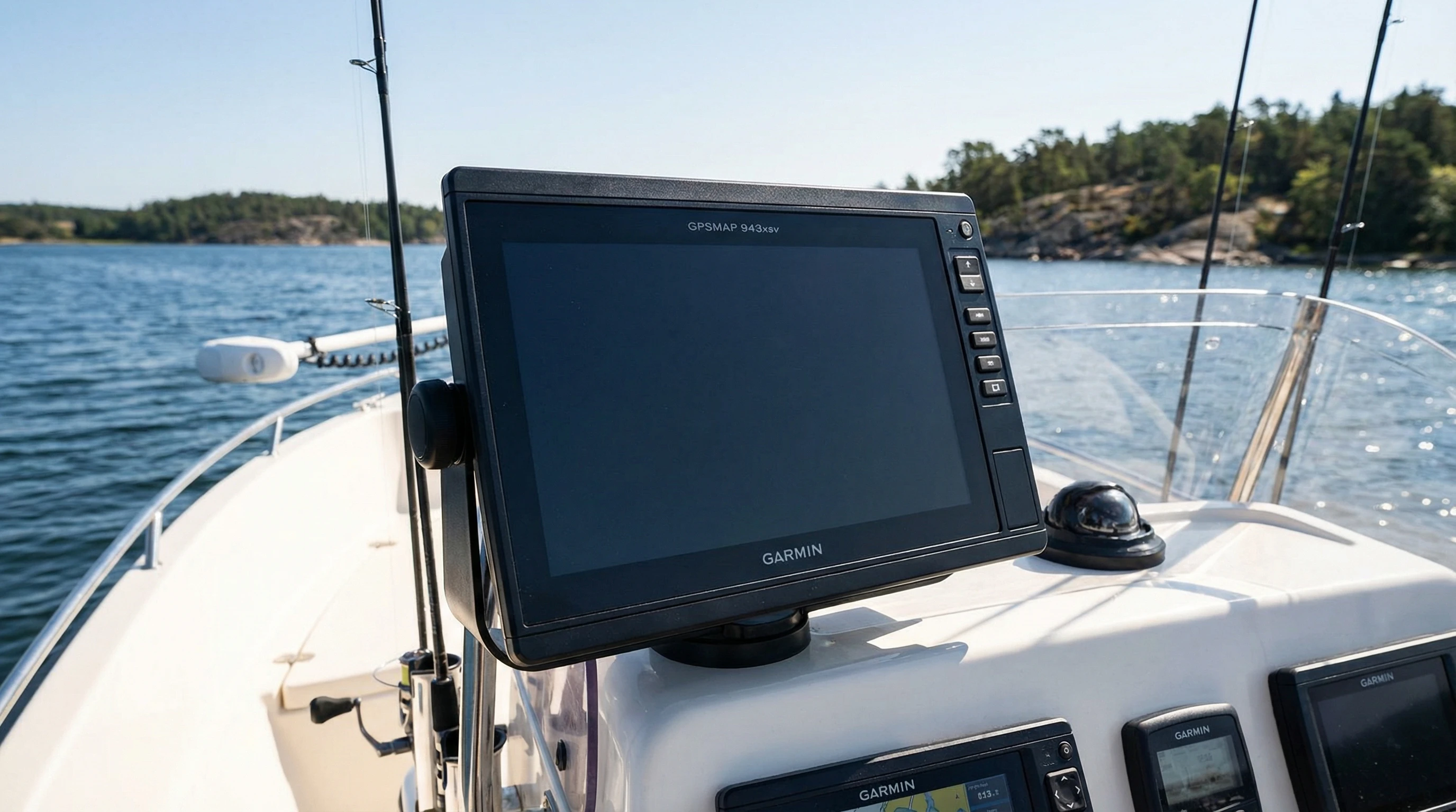 Garmin GPSMAP 943xsv mounted on a fishing boat, clear blue water in background