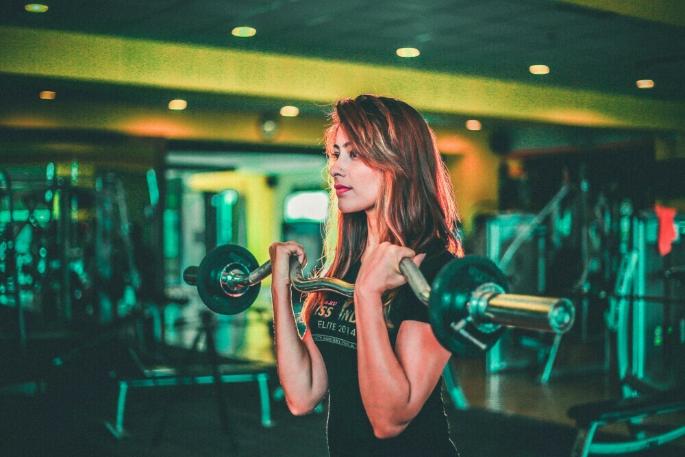 a woman doing strength and cardio workout 