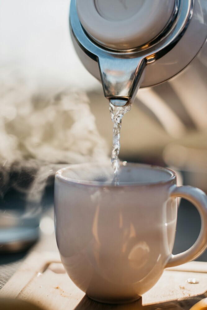 pouring water in a cup