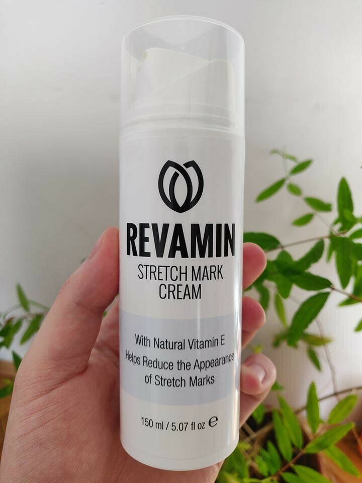 revamin stretch mark cream in hand