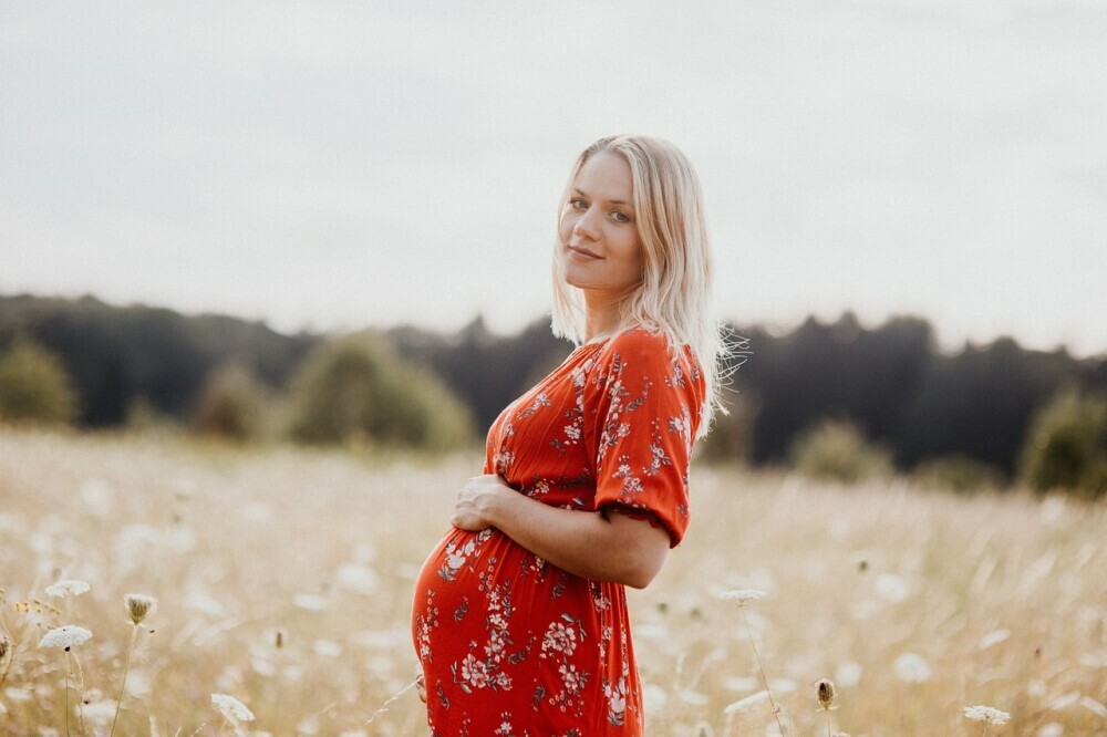 a pregnant woman in nature