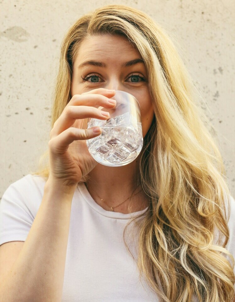 a woman drinking water