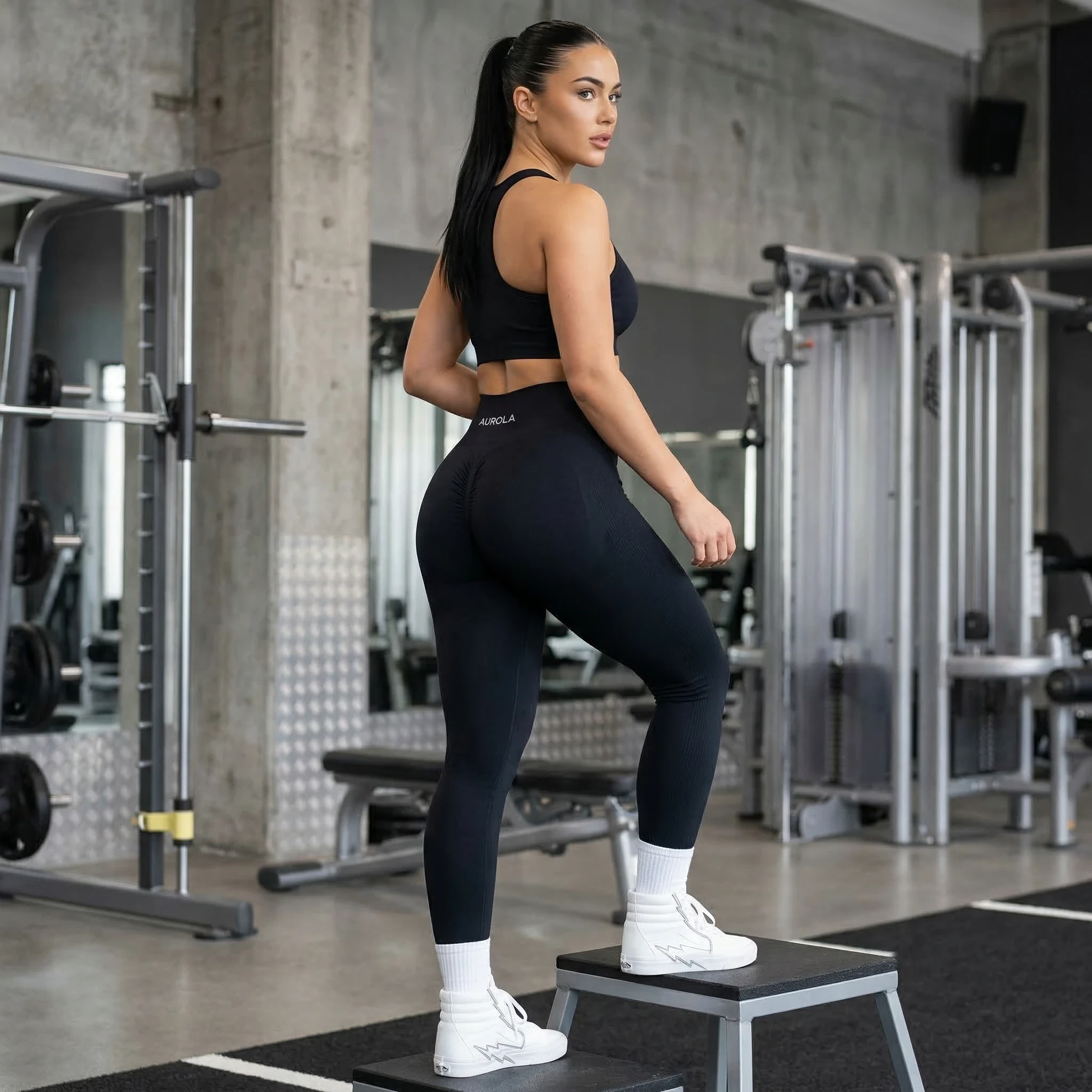 Woman wearing Seamless Scrunch high waist compression leggings in a gym setting