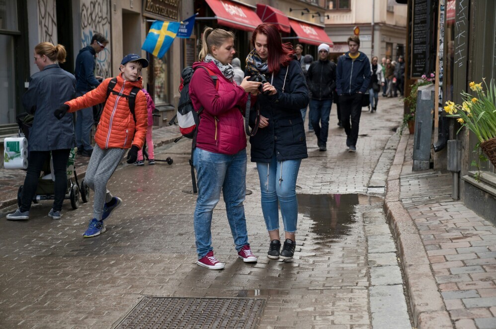 travelers walking on a street