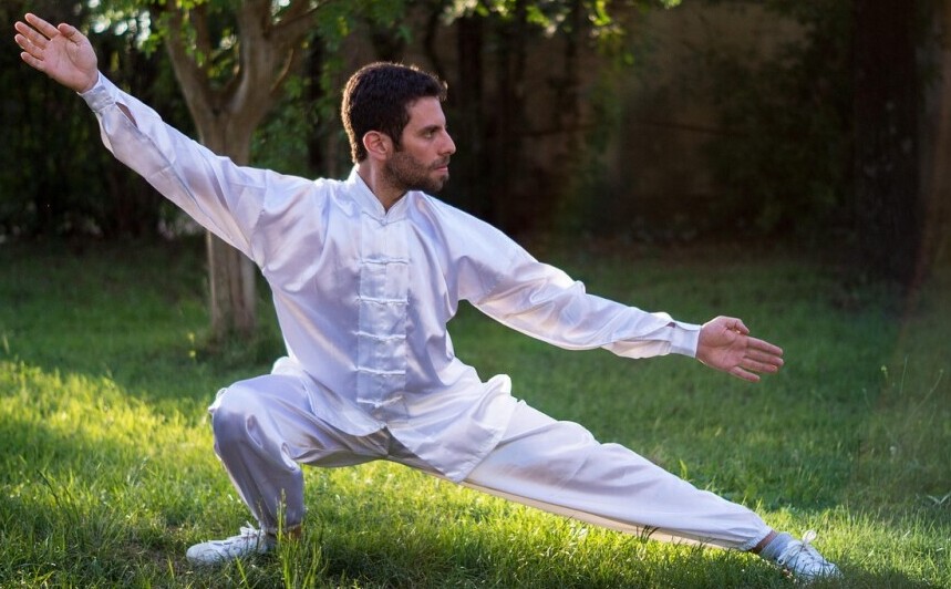 Person practicing tai chi meditation as part of ADHD devotional movement for mind-body integration