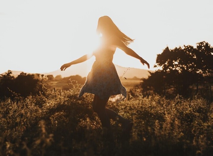 Girl Walking in the Grass
