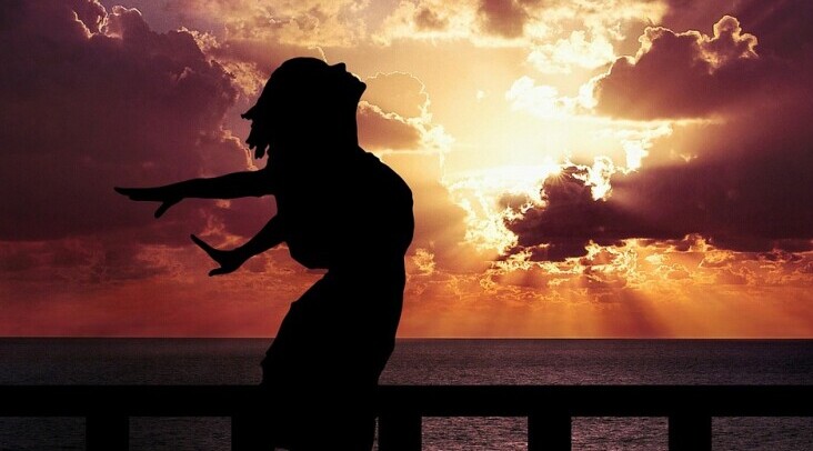 Breathing exercises on sunset beach