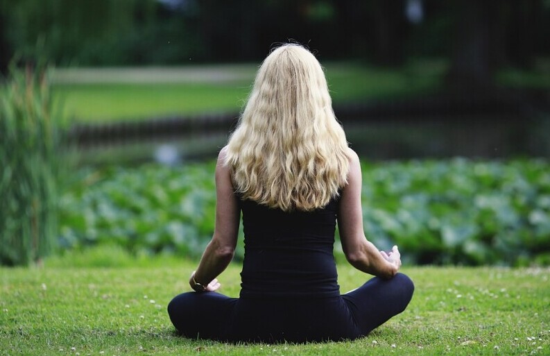 Woman Meditating Outside